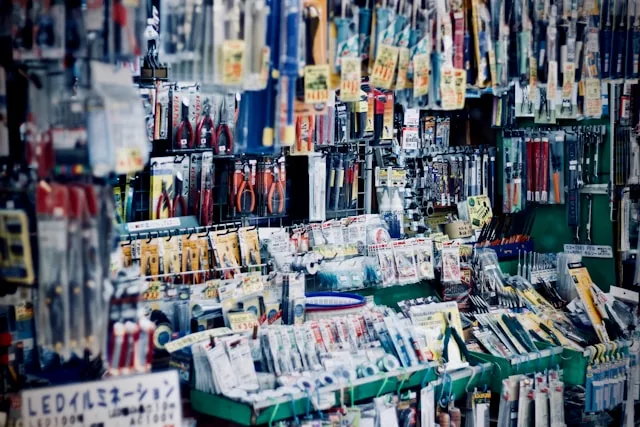 Photo of a shop wall crowded with packets of hand tools hanging on hooks